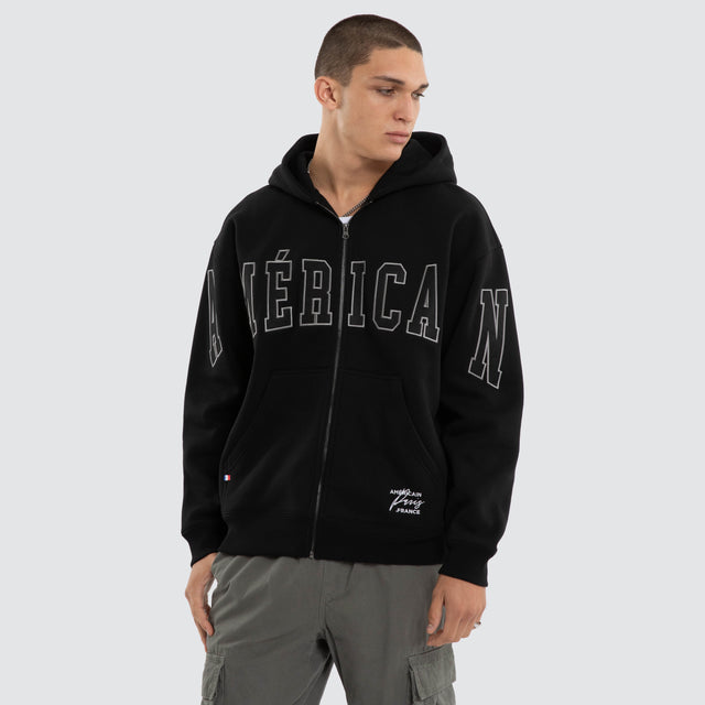 Model wears Armour Relaxed Zip Hoodie Jet Black Hoodies Black – image 1