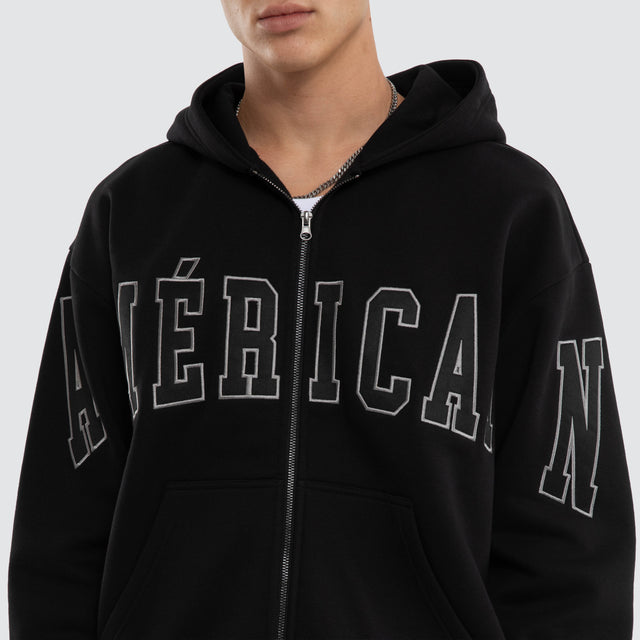 Model wears Armour Relaxed Zip Hoodie Jet Black Hoodies Black – image 4