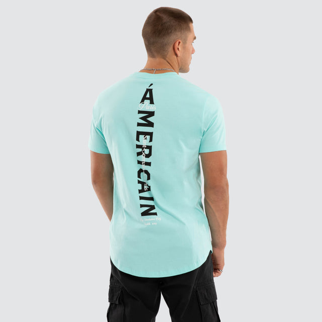 Model wears Saint Dual Curved Tee Auruba Blue T-Shirts Blue – image 1