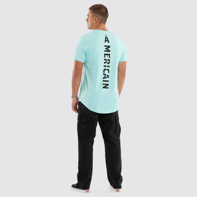 Model wears Saint Dual Curved Tee Auruba Blue T-Shirts Blue – image 5