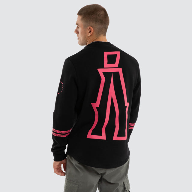 Model wears Sheild Dual Curved Sweater Jet Black Jumpers Black – image 1