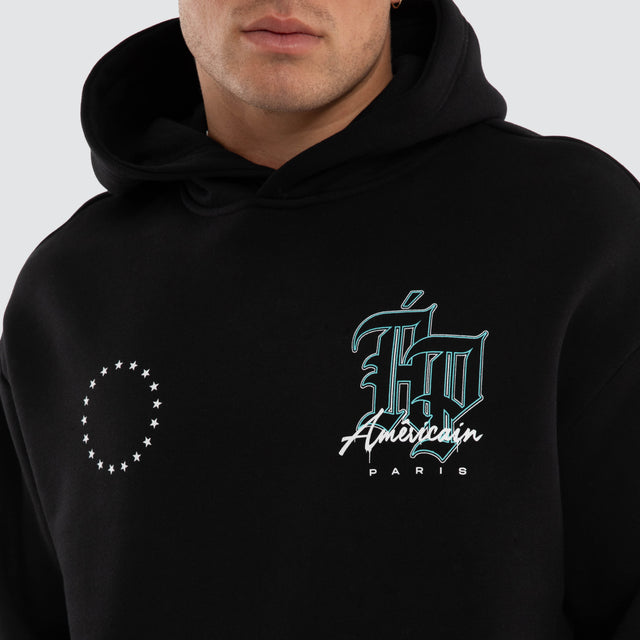 Model wears Vertigo Relaxed Hoodie Jet Black Hoodies Black – image 4
