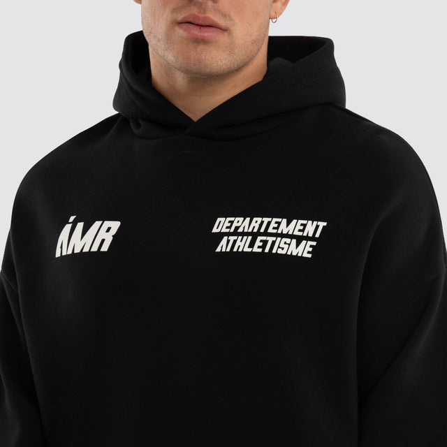 Model wears Department Athletic Hoodie Jet Black Hoodies Black – image 4