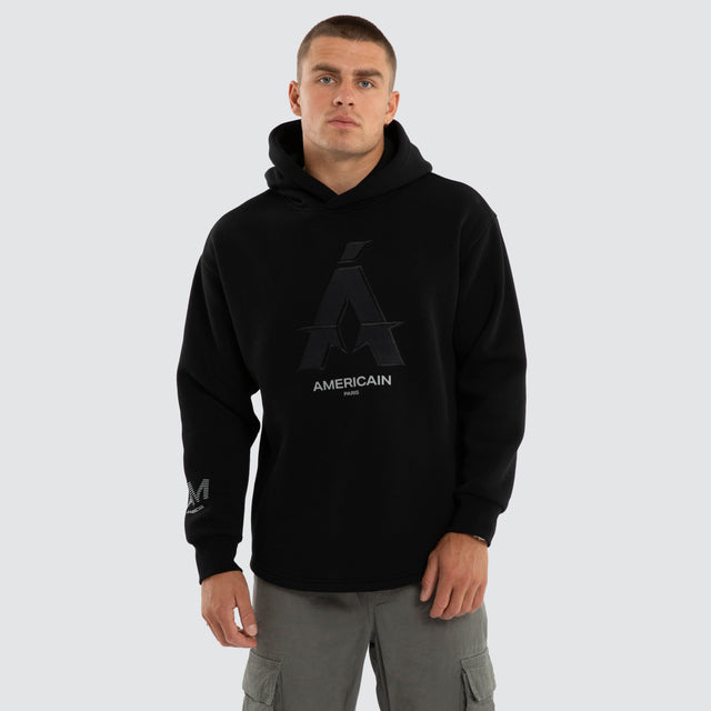 Model wears Motion Relax Dual Curve Hoodie Jet Black Hoodies Black – image 1
