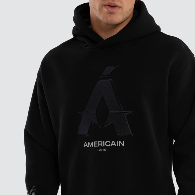 Model wears Motion Relax Dual Curve Hoodie Jet Black Hoodies Black – image 4