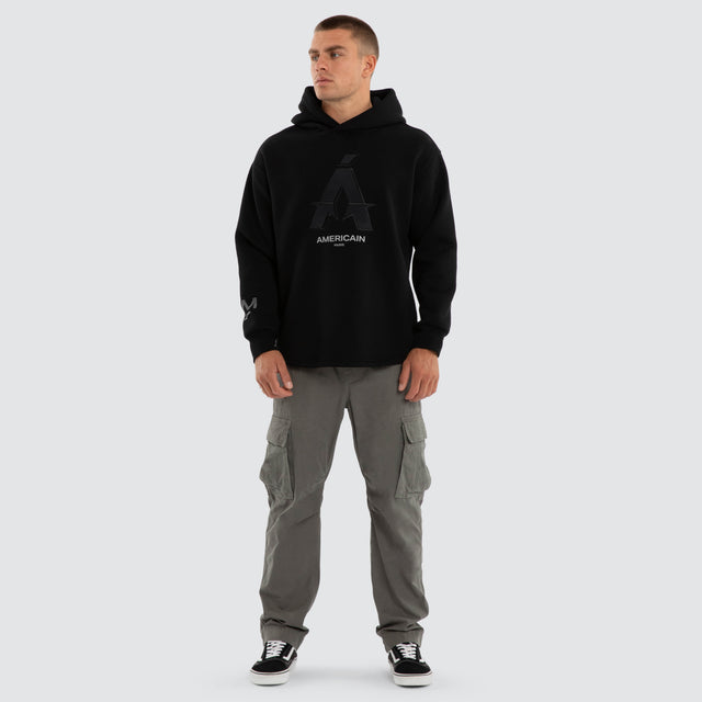 Model wears Motion Relax Dual Curve Hoodie Jet Black Hoodies Black – image 5