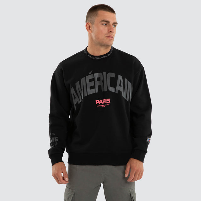 Model wears Flux Relaxed Sweater Jet Black Jumpers Black – image 1