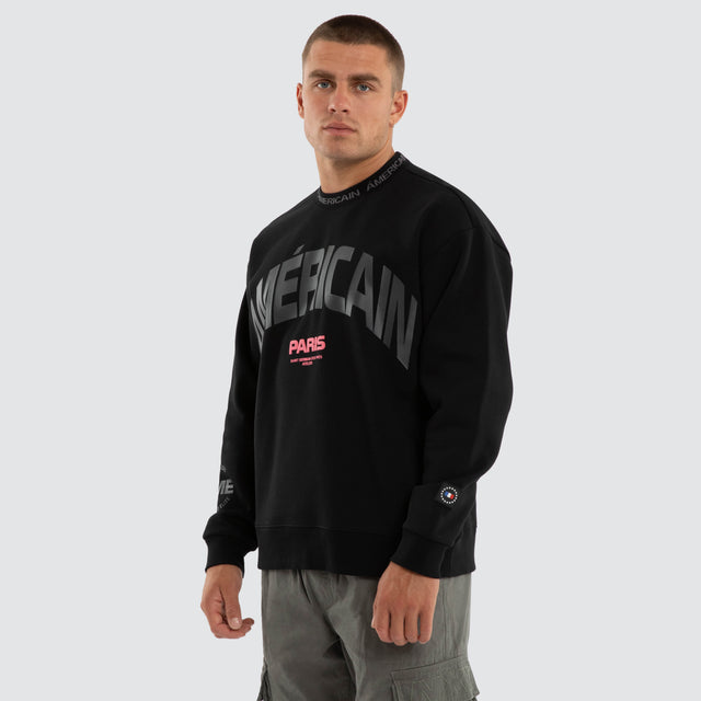 Model wears Flux Relaxed Sweater Jet Black Jumpers Black – image 3