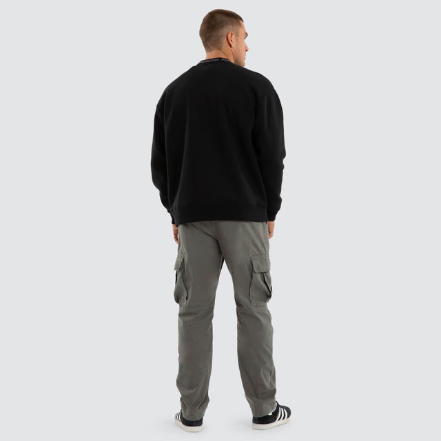 Model wears Flux Relaxed Sweater Jet Black Jumpers Black – image 2