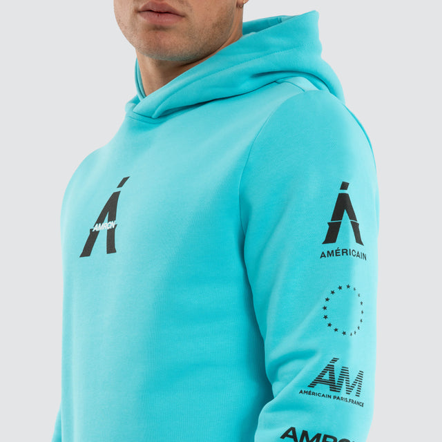 Model wears Delta Dual Curved Hoodie Blue Curacao Hoodies Blue – image 4