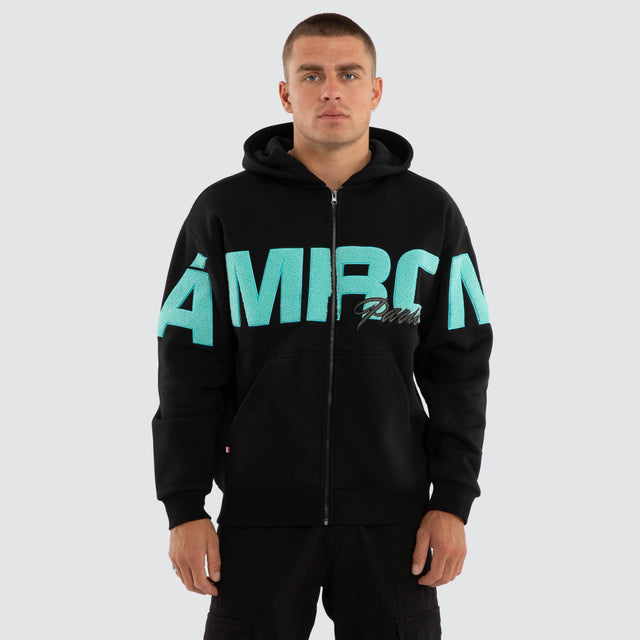 Model wears Halo Relaxed Zip Hoodie Jet Black Hoodies Black – image 1