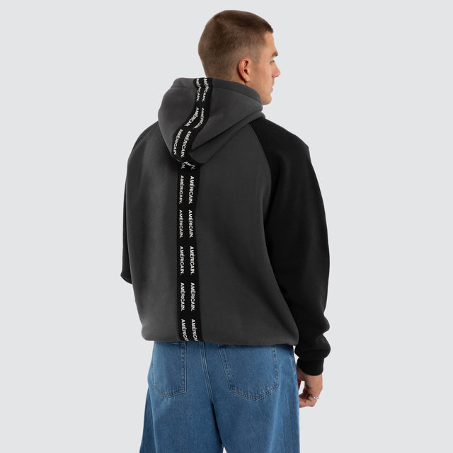 Model wears Axis Raglan Hoodie Asphalt/Anthracite Hoodies Black – image 1