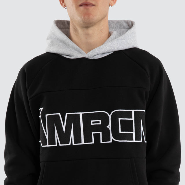 Model wears Blockade Raglan Hoodie Anthracite/Grey Marle Hoodies Black – image 3