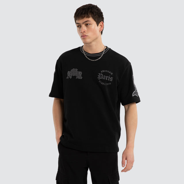 Model wears Grind Loopback Oversized Tee Jet Black T-Shirts Black – image 1