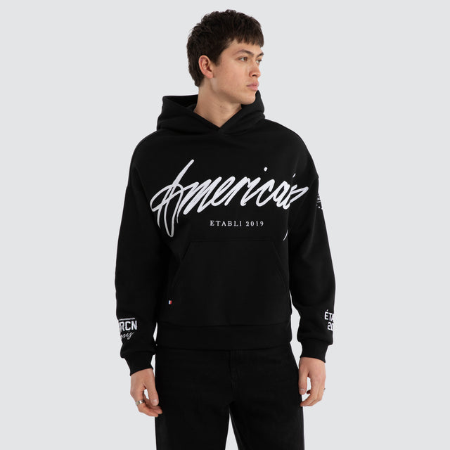 Model wears Legend Relaxed Hoodie Jet Black/White Hoodies Black – image 2