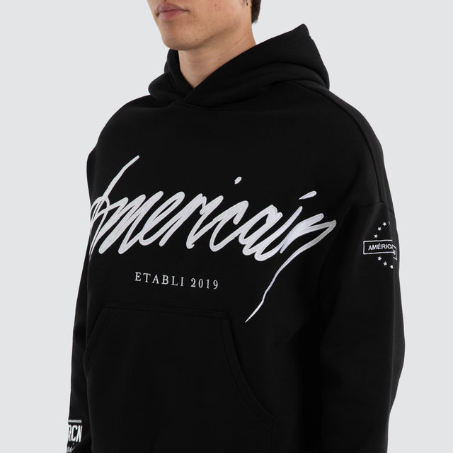 Model wears Legend Relaxed Hoodie Jet Black/White Hoodies Black – image 6