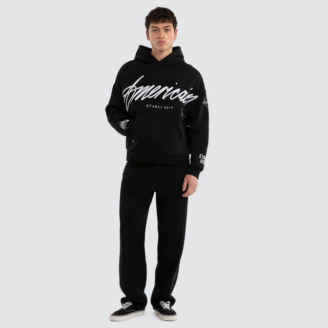 Model wears Legend Relaxed Hoodie Jet Black/White Hoodies Black – image 4