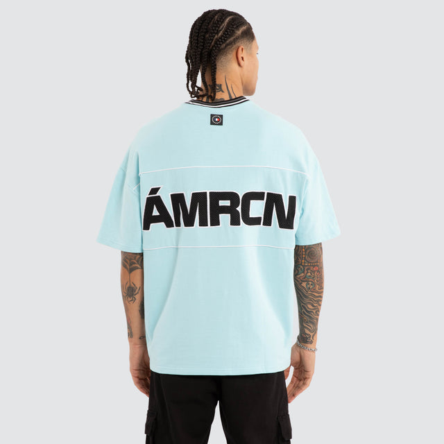Model wears Blockade Winner Tee Aquaesque T-Shirts Blue – image 1