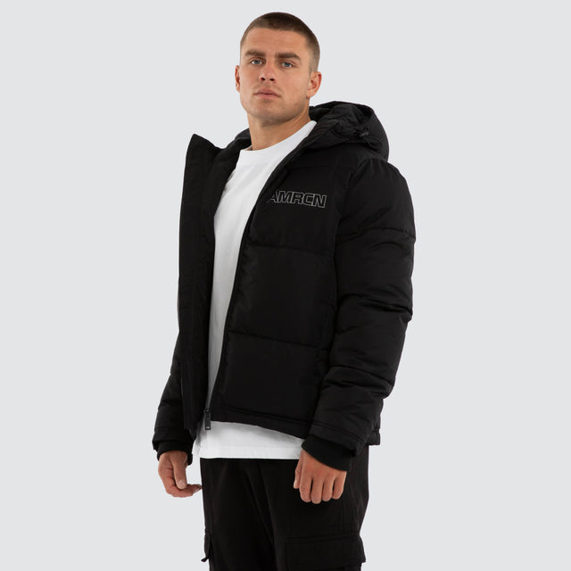 Model wears Vector Hooded Puffer Jacket Jet Black Jackets Black – image 3