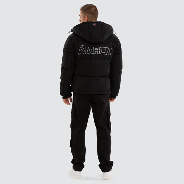 Model wears Vector Hooded Puffer Jacket Jet Black Jackets Black – image 2