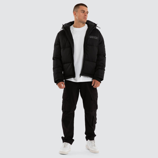 Model wears Vector Hooded Puffer Jacket Jet Black Jackets Black – image 5