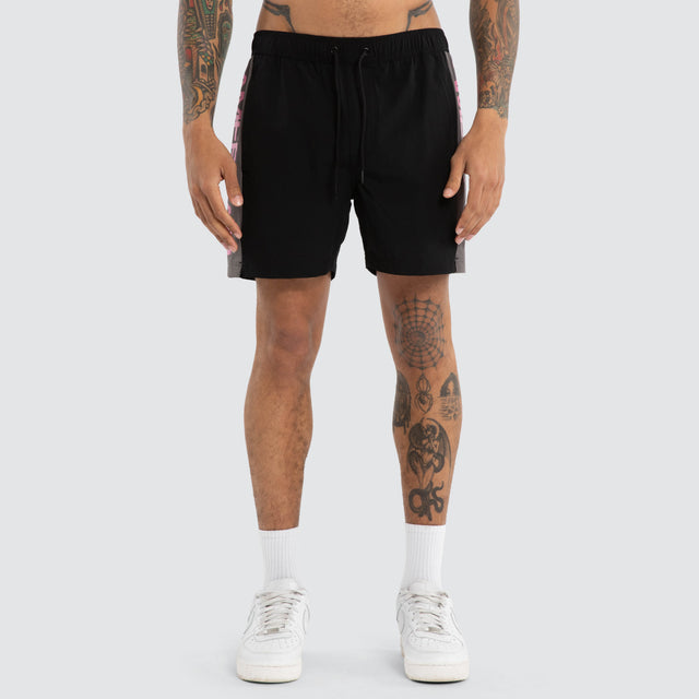 Model wears Grima Beach Short Jet Black/Pink Shorts Black – image 5