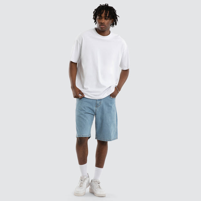 Model wears Dillon Denim Jort Mid Blue Shorts Blue – image 2