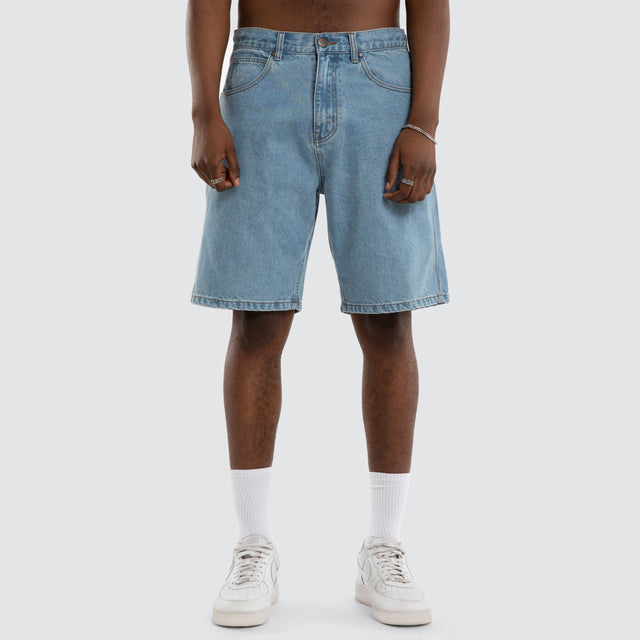 Model wears Dillon Denim Jort Mid Blue Shorts Blue – image 3