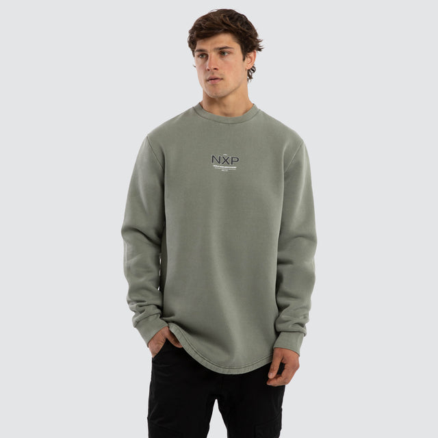 Model wears Overtake Dual Curved Sweater Pigment Shadow Jumpers Green – image 3
