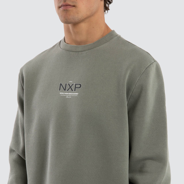 Model wears Overtake Dual Curved Sweater Pigment Shadow Jumpers Green – image 4