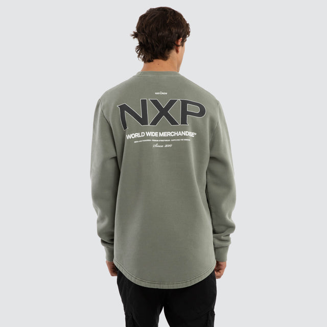 Model wears Overtake Dual Curved Sweater Pigment Shadow Jumpers Green – image 1