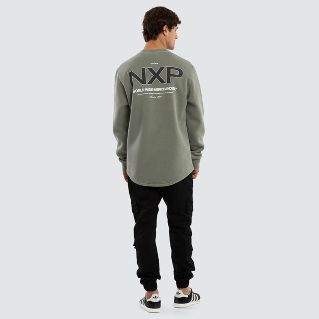 Model wears Overtake Dual Curved Sweater Pigment Shadow Jumpers Green – image 5