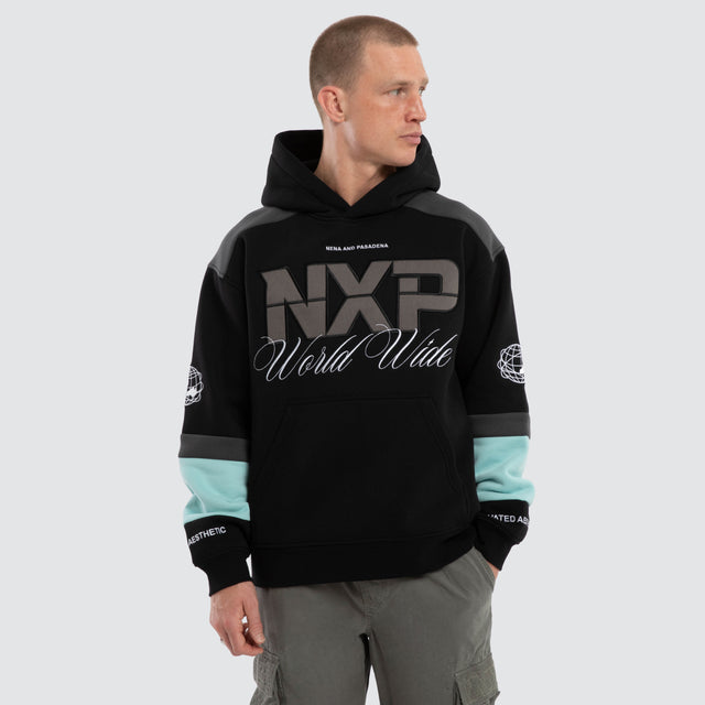 Model wears Wordly Relaxed Hoodie Jet Black Hoodies Black – image 1