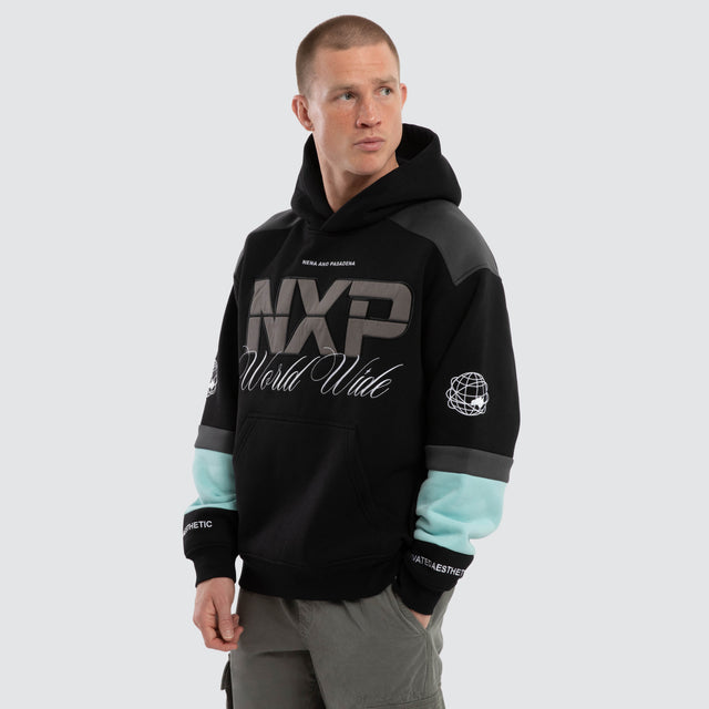 Model wears Wordly Relaxed Hoodie Jet Black Hoodies Black – image 3
