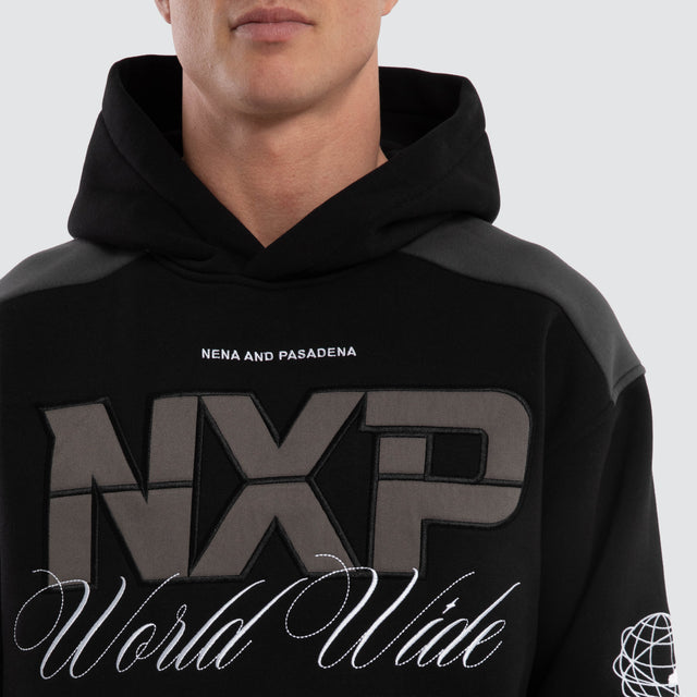 Model wears Wordly Relaxed Hoodie Jet Black Hoodies Black – image 4