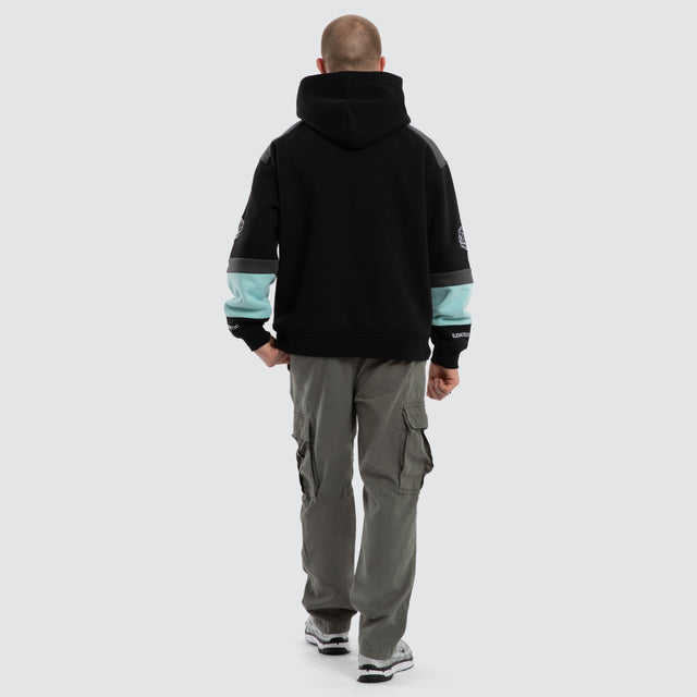Model wears Wordly Relaxed Hoodie Jet Black Hoodies Black – image 2