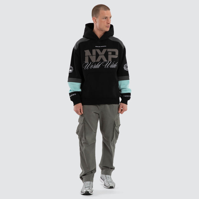 Model wears Wordly Relaxed Hoodie Jet Black Hoodies Black – image 5