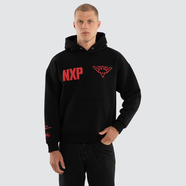 Model wears Essendon Bombers AFL Top Tier Hoodie Jet Black Hoodies Black – image 2