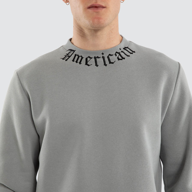 Model wears Script Dual Curved Sweater Neutral Grey Jumpers Grey – image 5