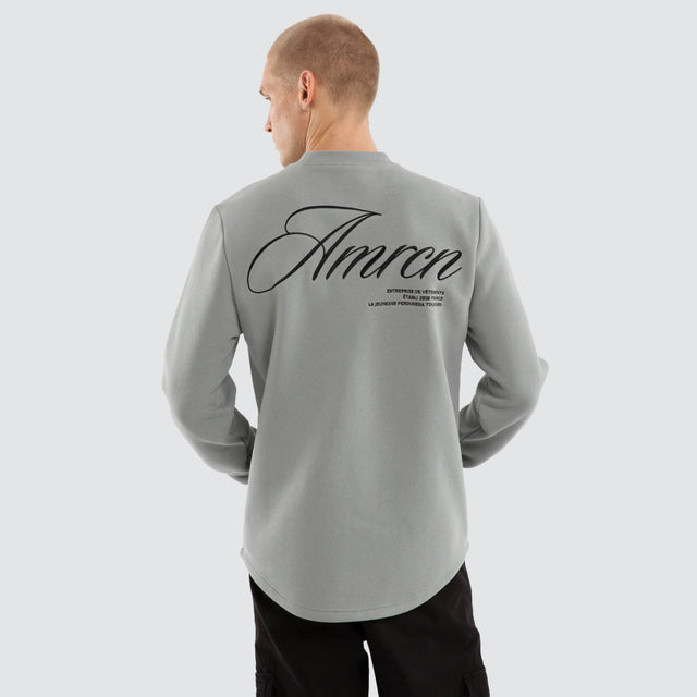 Model wears Script Dual Curved Sweater Neutral Grey Jumpers Grey – image 1