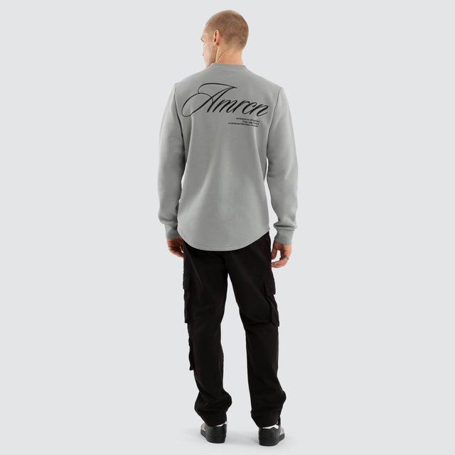 Model wears Script Dual Curved Sweater Neutral Grey Jumpers Grey – image 3