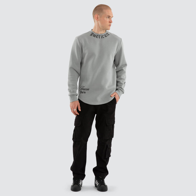 Model wears Script Dual Curved Sweater Neutral Grey Jumpers Grey – image 2