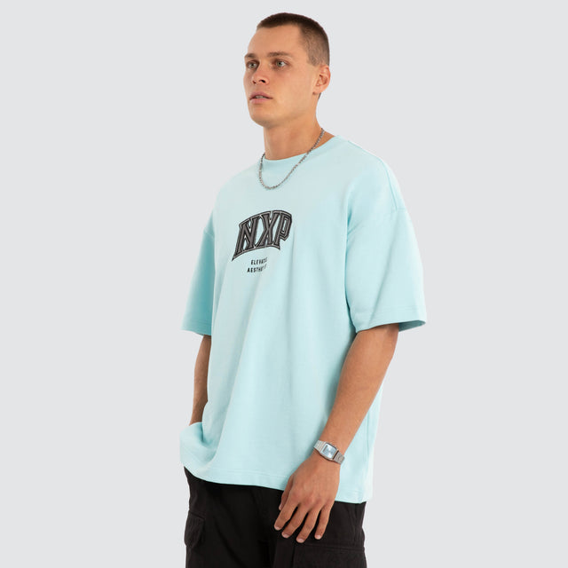 Model wears NXP Factor Loopback Raptor Tee Blue T-Shirts in Blue - Image 3