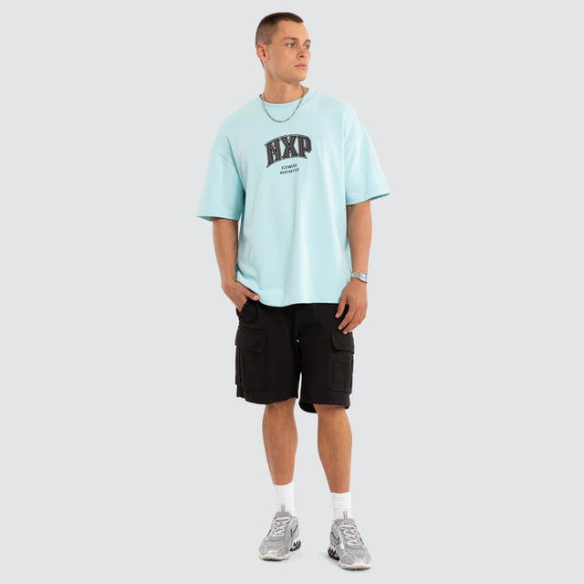 Model wears NXP Factor Loopback Raptor Tee Blue T-Shirts in Blue - Image 6