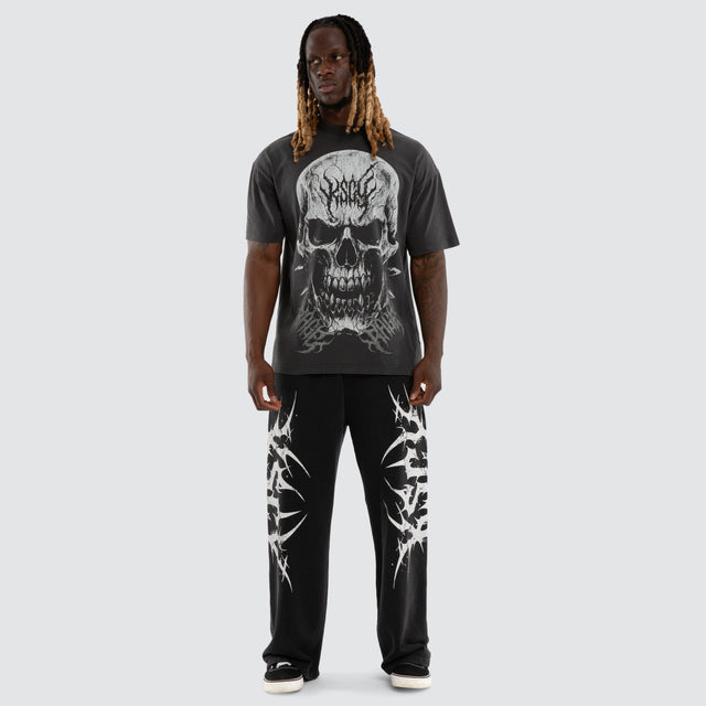 Model wears Creeper Pump Cover Raptor Tee Pigment Black T-Shirts Black – image 5