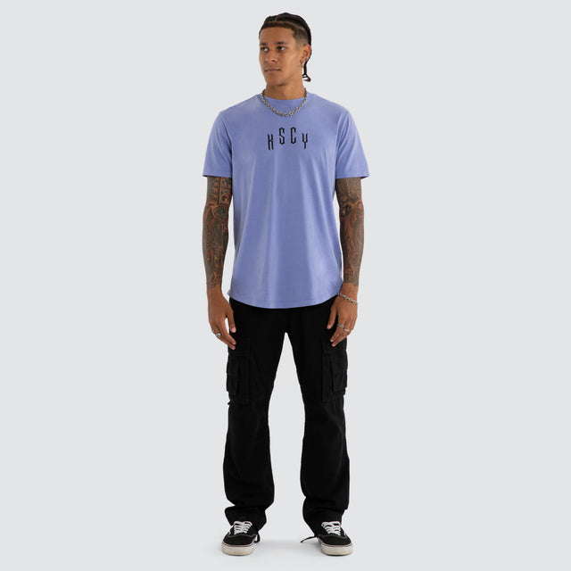Model wears Trapped Dual Curved Tee Pigment Purple Trumpet T-Shirts Purple – image 2