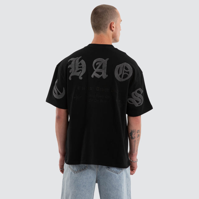 Model wears Crowned Loopback Street Tee Jet Black T-Shirts Black – image 1