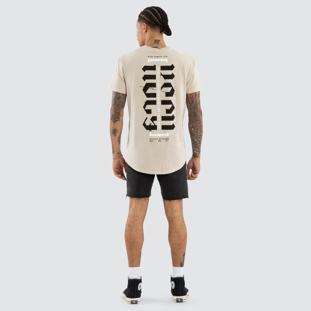 Model wears Sacred Dual Curved Tee Pigment Silver Cloud T-Shirts Grey – image 3