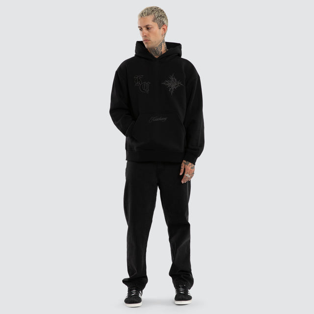 Model wears Paragons Relaxed Hoodie Jet Black Hoodies Black – image 2