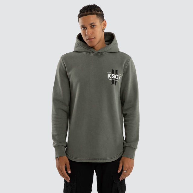 Model wears Inferno Dual Curved Hoodie Pigment Basil Hoodies Green – image 3